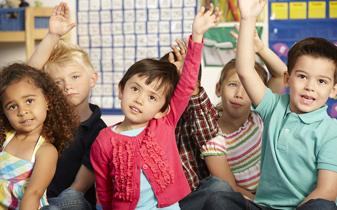Children with hands in air Children with hands in air