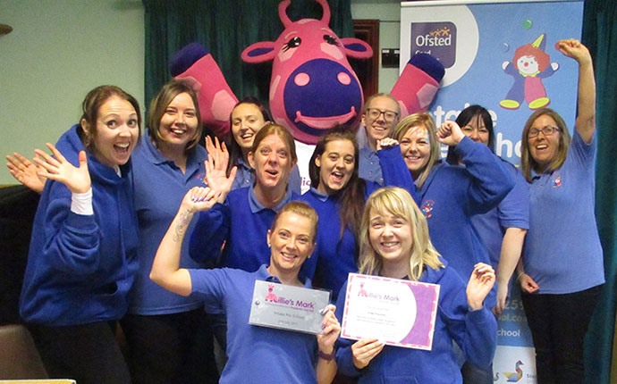 Intake Preschool celebrationg being awarded Millie's Mark with Millie Giraffe Picture of Intake Preschool celebrationg being awarded Millie's Mark with Millie Giraffe.